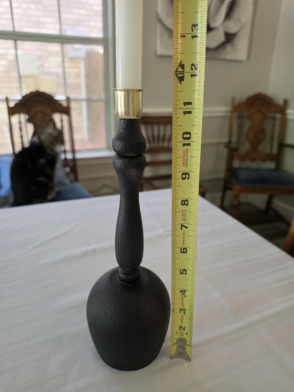 Black and gold taper candlestick holder Bulbous base Sleek turned spindle neck